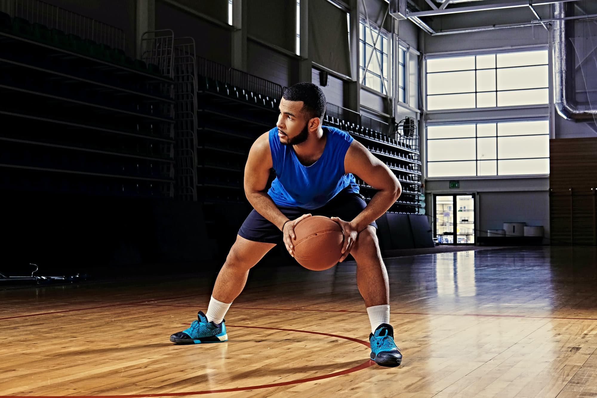 Professional basketball player in action on a basketball field.